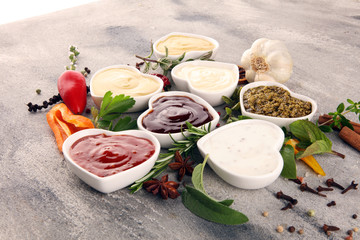 Sauces Assortment. Set of various sauces in bowls with ketchup, mayonnaise, pesto and mustard. Variety of induvidual marinades.