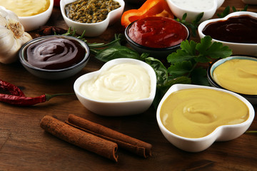 Sauces Assortment. Set of various sauces in bowls with ketchup, mayonnaise, pesto and mustard. Variety of induvidual marinades.