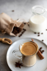 Dalgona coffee. Iced fluffy creamy whipped trend drink with coffee foam and milk. Trendy drink during Covid-19 city lock down and self quarantine, stay at home concept.