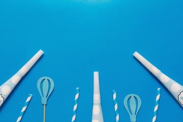 flatlay Birthday party card on a blue background with copy space for text.