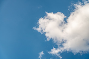A low angle shot of a beautiful cloudscape on a blue sky background