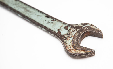 old spanner on a white background