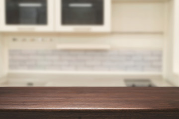 Wood desk space and blurred of kitchen background. for product display montage. business presentation.