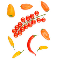 Cherry tomatoes, cayenne and chili pepper isolated on a white background. View from above.