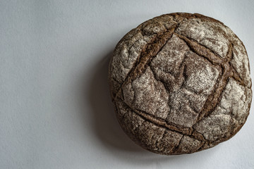 Appetizing black bread on a granite background