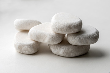 Pile of white stones on a white background
