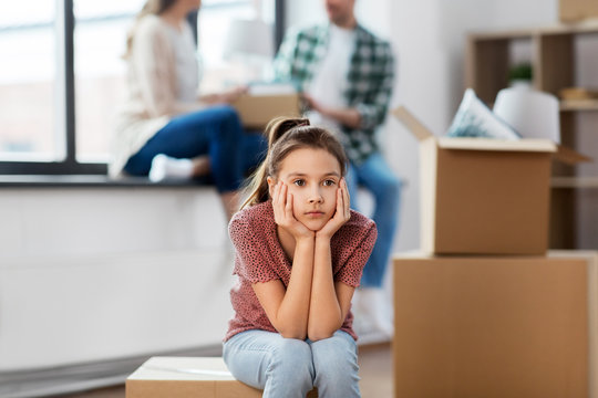 Mortgage, Family And Real Estate Concept - Sad Girl Moving To New Home With Mother And Father Packing Things