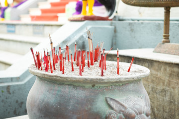 Joss sticks burning in the pot
