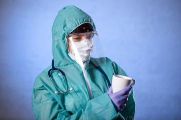 tired doctor rests after admitting a large number of patients due to an outbreak of coronavirus, Tired doctor in the hospital