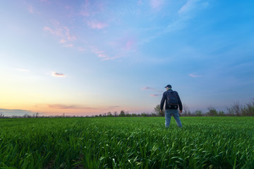 man looks at the sky / bright spring landscape