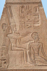 Closeup of hieroglyphic carvings on an ancient egyptian temple obelisk