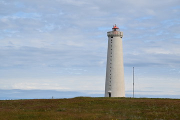 Fototapeta na wymiar Gardur Folk Museum - photograph of an old lighthouse on the Icelandic coast, just outside the city of Reykjavik.