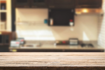 Wood desk space and blurred of kitchen background. for product display montage. business presentation.