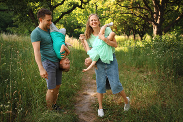 Fototapeta premium Happy loving family with two children, son and daughter playing and hugging. Family walk. Happy Mothers day.