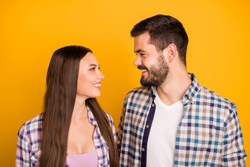 Closeup photo pretty lady handsome guy toothy smiling tenderness look eyes with love emotions hugging stand close wear casual plaid shirts isolated yellow color background