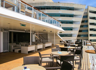 Terrace or patio or balcony on outdoor deck of luxury Hapag-Lloyd cruiseship or cruise ship liner...