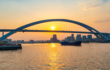 Fototapeta na wymiar Sunset view of Lupu Bridge, Shanghai, China