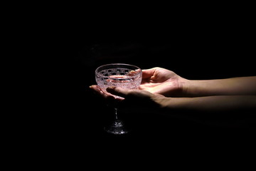 Hand holds an empty wine glass 1