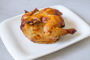 whole roasted chicken isolated on white background