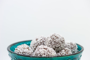 Coconut balls in a turquoise bowl