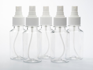 set of clear bottles with a spray for antiseptic against coronovirus covid19