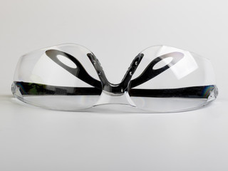 safety glasses for eyes with transparent glasses and black plastic frames