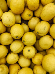 lots of ripe yellow lemon for cooking background