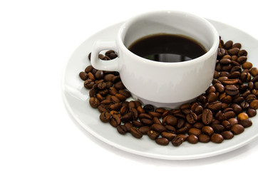 white cup of coffee in a white plate. Coffee beans. White background.