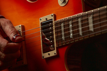 Close up of guitar  player with electric guitar