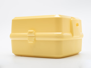 bright yellow lunch box with compartments with individual Cutlery