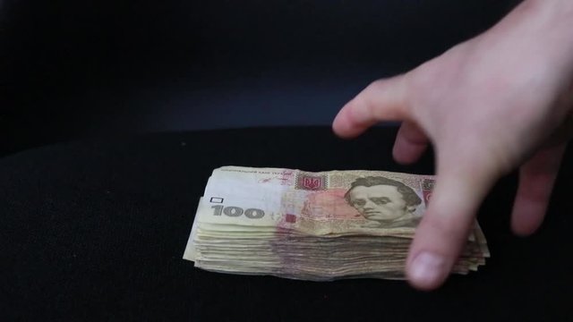 pack of banknotes on a black background