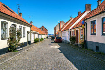 Fototapeta na wymiar Empty streets of traditional old townhouses in Simrishamn, Southern Sweden.