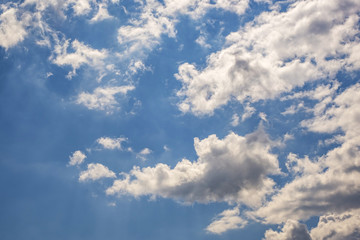 Naklejka na ściany i meble Blue sky background with big tiny stratus cirrus striped cloud before storm.
