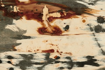 abstract grunge background, artistic painting with black paint on a light wooden background,...