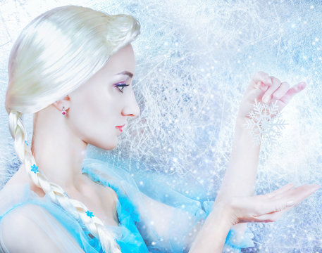 Frozen princess on the snowy silver background close up
