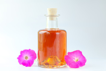 petunia essential oil in  beautiful bottle on White background