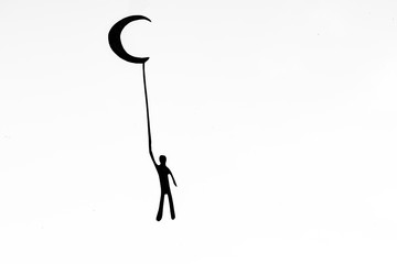 Boy flies to the moon, dream concept.