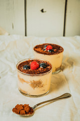 Tiramisu white background and teaspoon with chocolate
