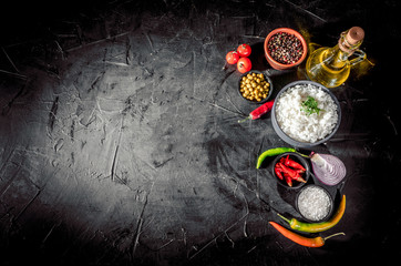 Appetizing healthy rice with vegetables on dark background. Healthy eating