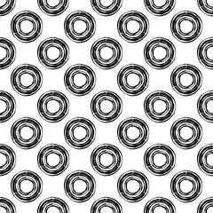 Black-and-white figures with curved stripes. Ethnic boho ornament. Seamless background. Tribal motif. Vector illustration for web design or print.