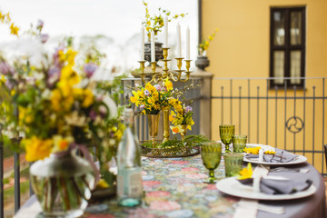 restaurant terrace decorated and table served with flowers and candles for wedding romantic dinner  