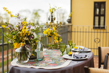 restaurant terrace decorated and table served with flowers and candles for wedding romantic dinner  