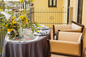 restaurant terrace decorated and table served with flowers and candles for wedding romantic dinner  