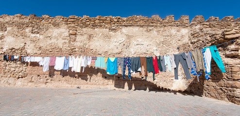 Clothes dried on rope or clothesline in a street in Morocco