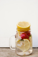 Fresh lemonade with lemon and strawberries