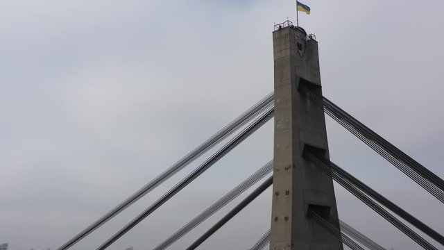 Aerial drone view View Of North or Moscow Bridge Kiev, Ukraine over Dnieper.  City view. Traffic on the bridge. Fog. Rotation around the bridge