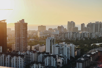 Fototapeta premium Cityscape at sunset in the city of Sanya. Hainan island