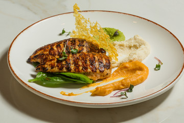 Grilled chicken breasts potato and carrot puree