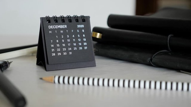 Small black calendar standing on the office desk. December month 2020 Year.