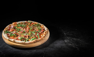 Tasty italian pizza on dark background. Pizza menu. Top view with copy space